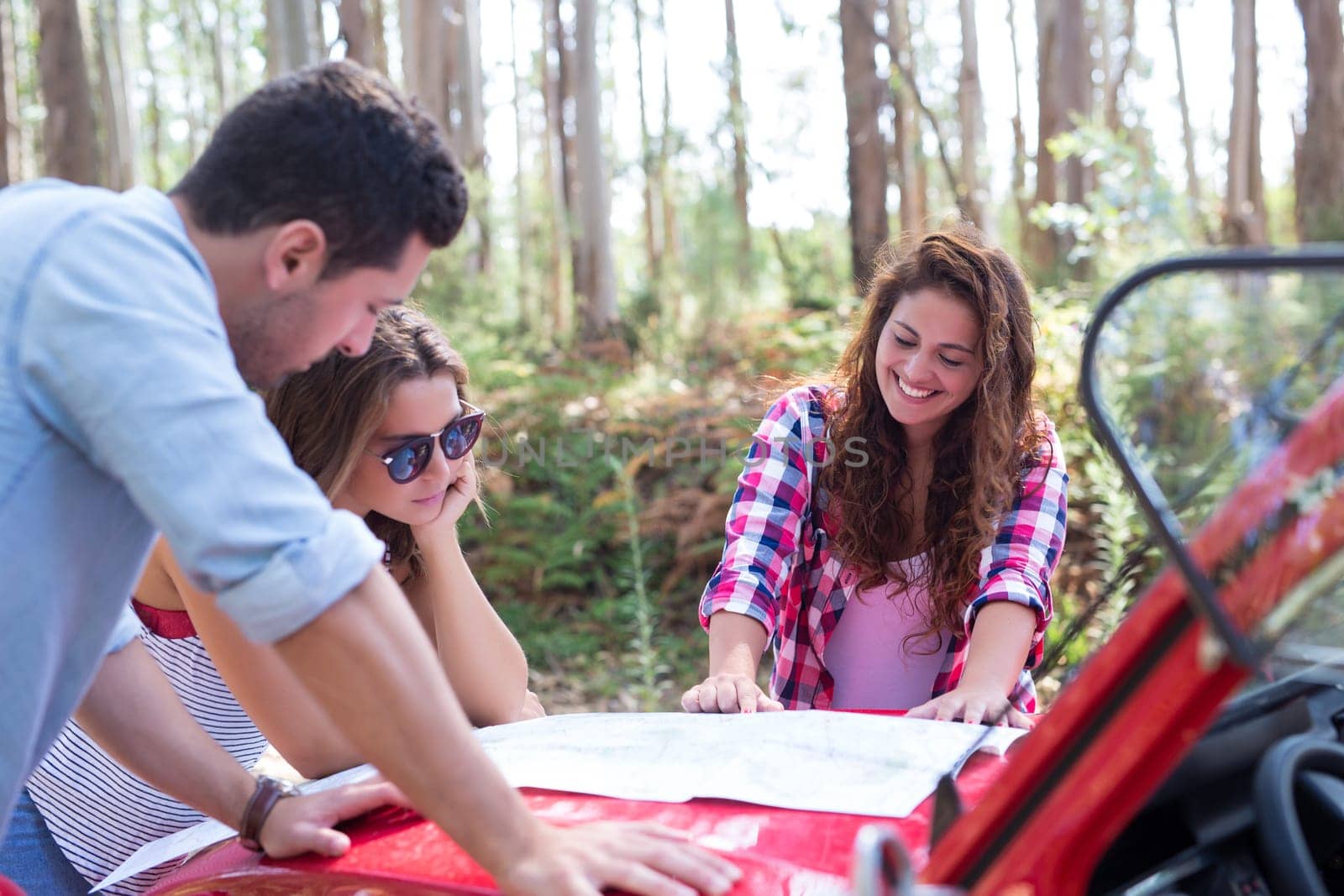 Group of friends on a roadtrip through countryside