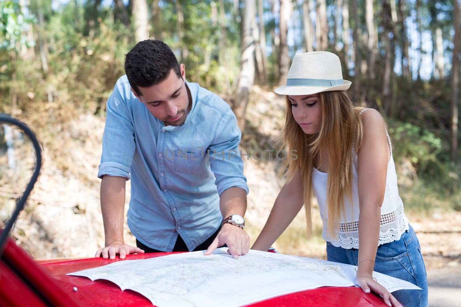 Young couple on roadtrip through countryside