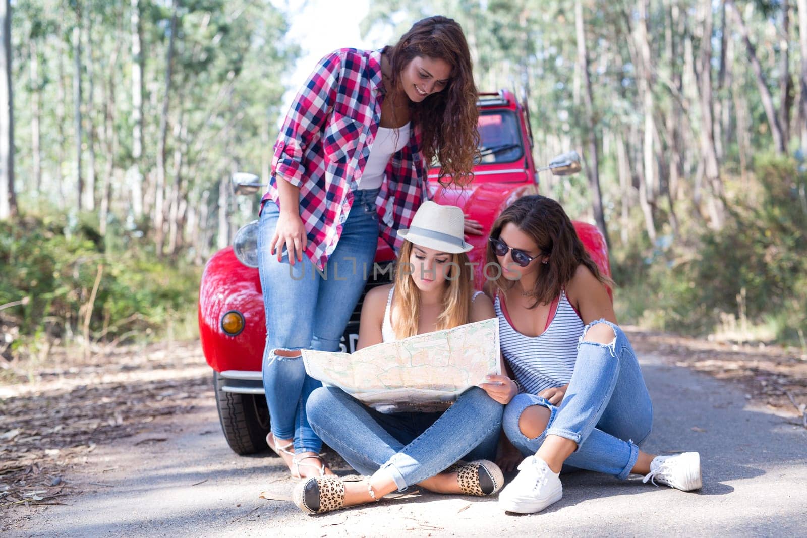 Group of friends on a roadtrip through countryside