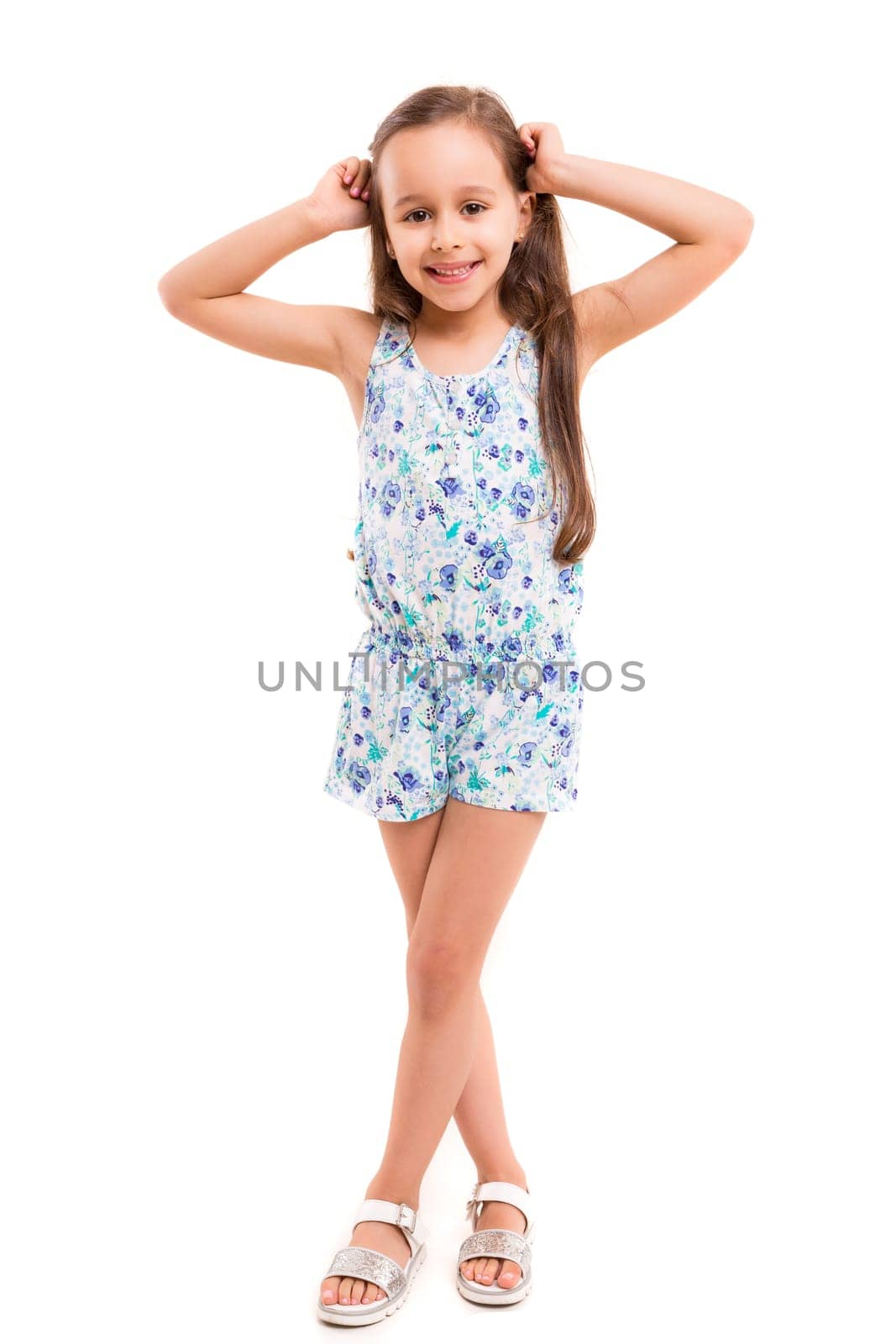 Beautiful young girl posing isolated over white