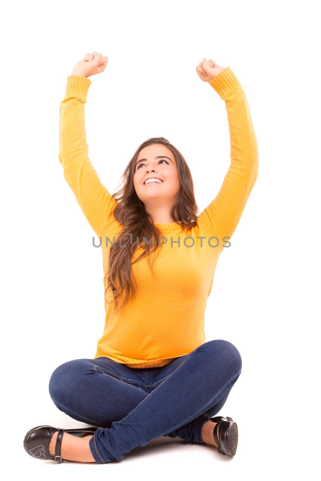 Very happy woman raising her arms and celebrating