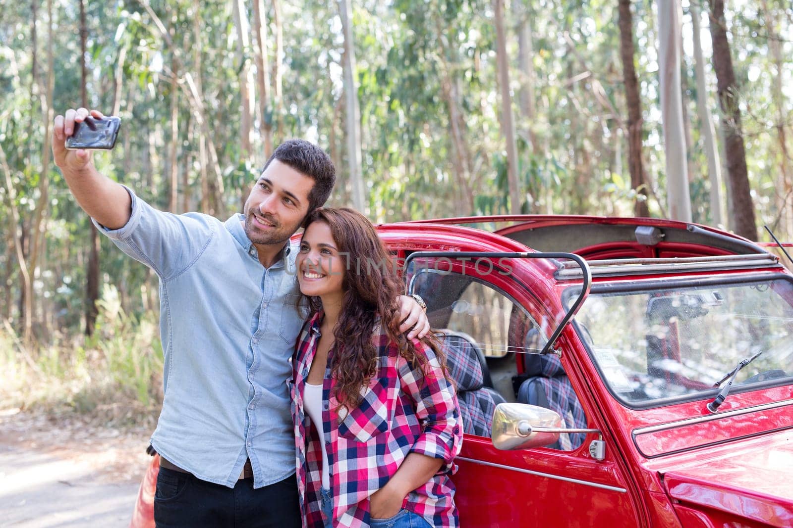 Young couple on roadtrip through countryside