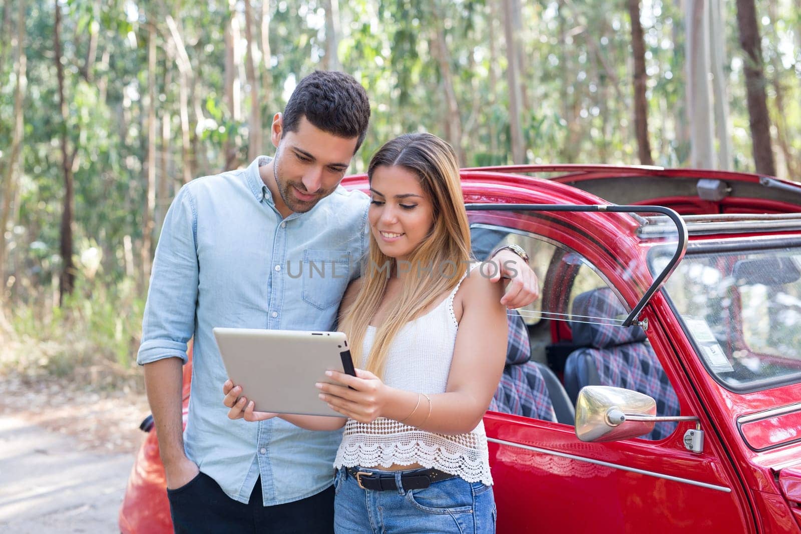 Young couple on roadtrip through countryside