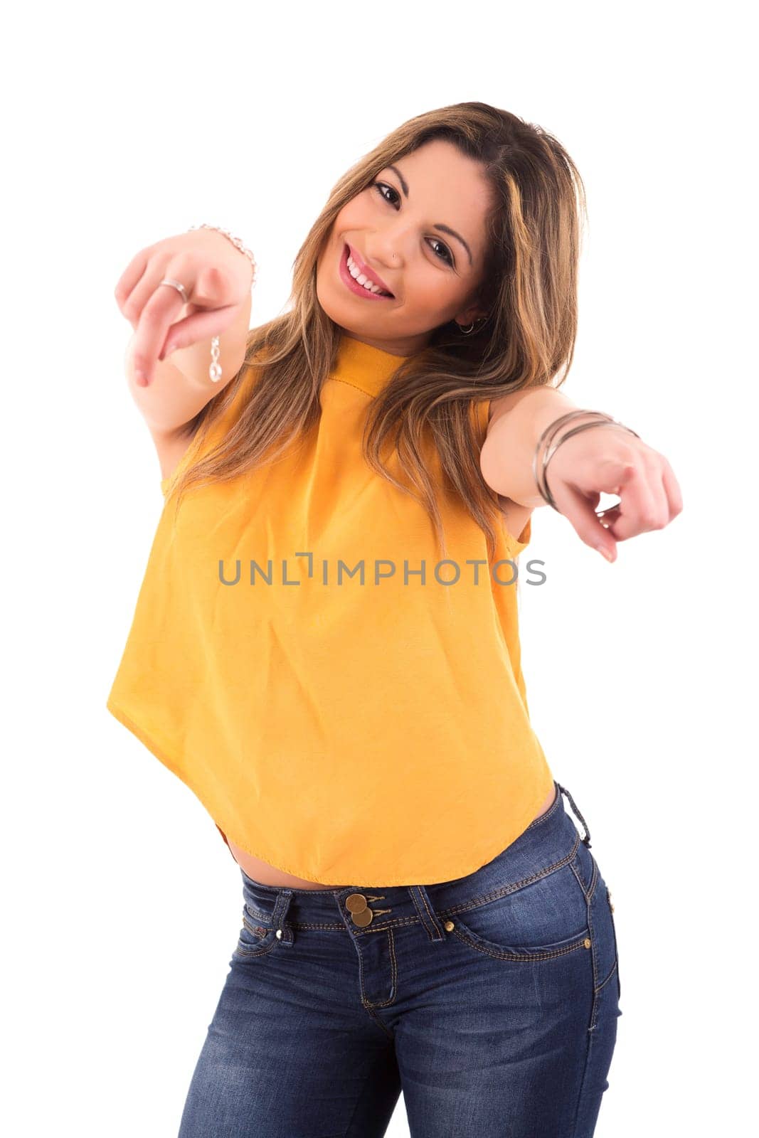 Young beautiful woman pointing at you, isolated over white