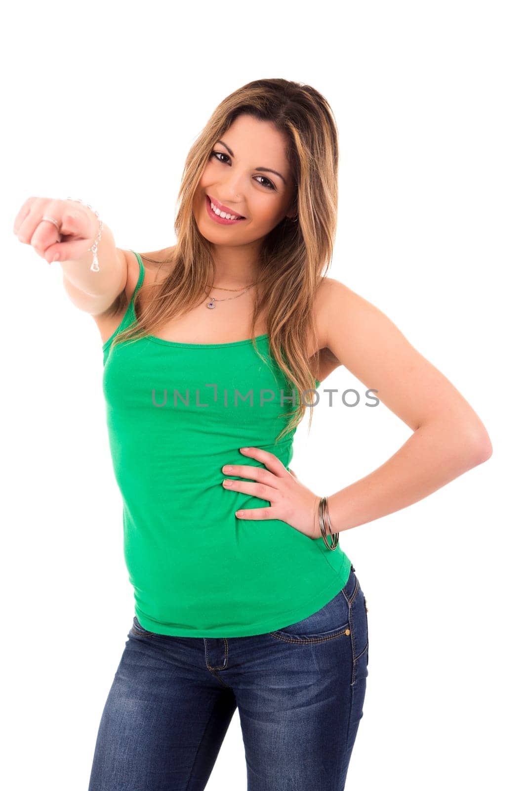 Young beautiful woman pointing at you, isolated over white