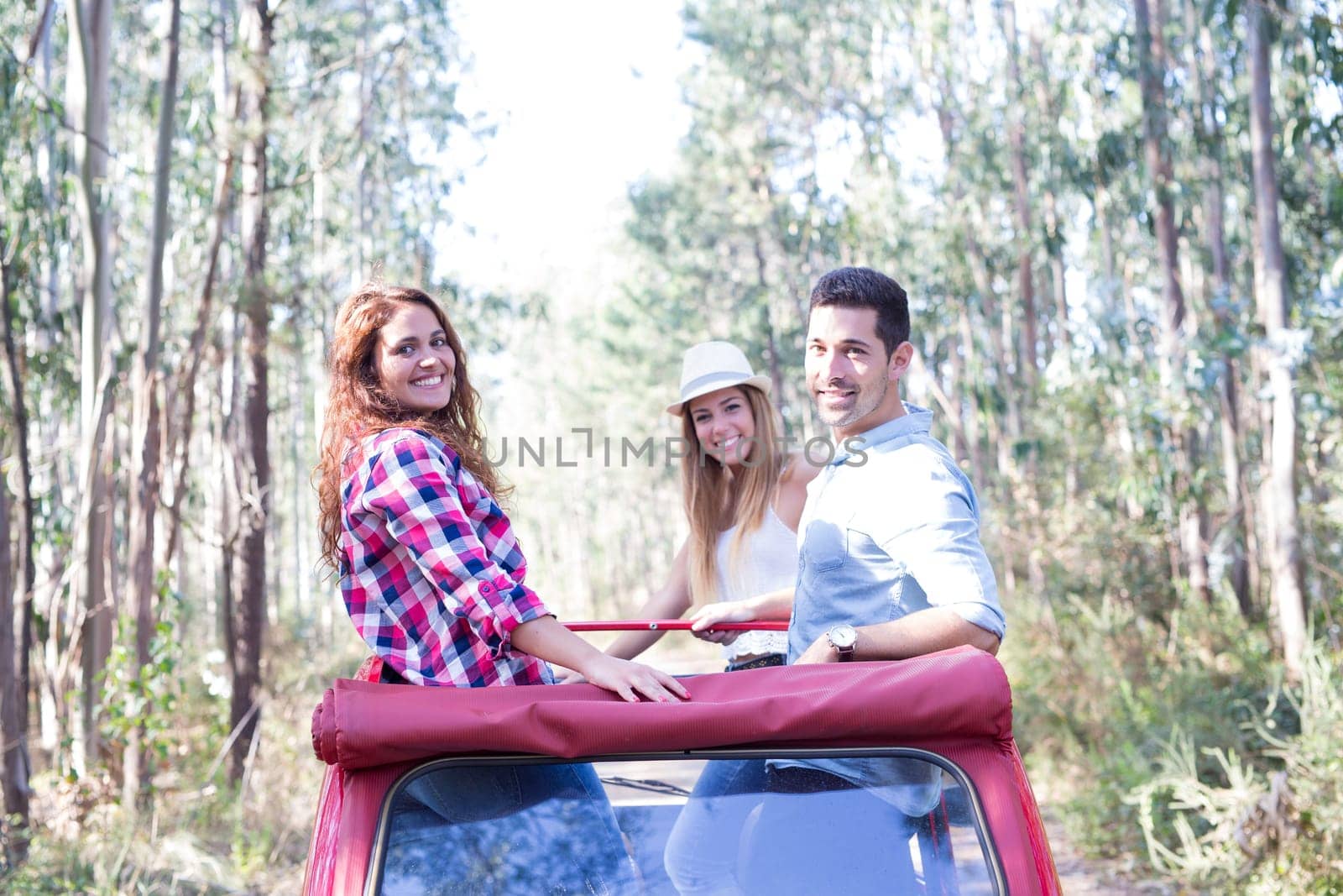 Group of friends on a roadtrip through countryside
