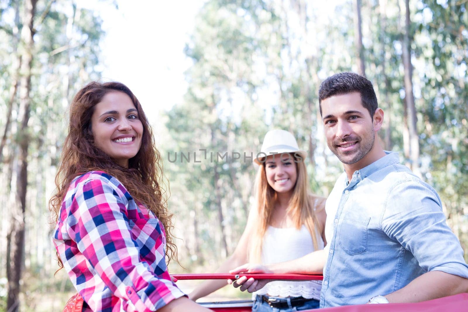 Group of friends on a roadtrip through countryside