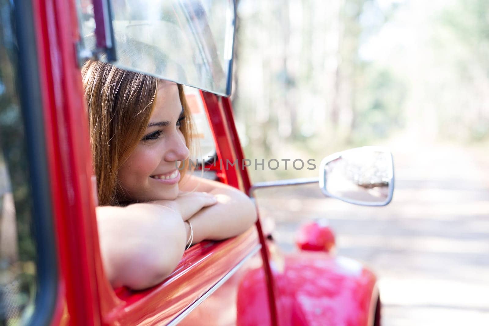Woman going on a roadtrip in her convertible car