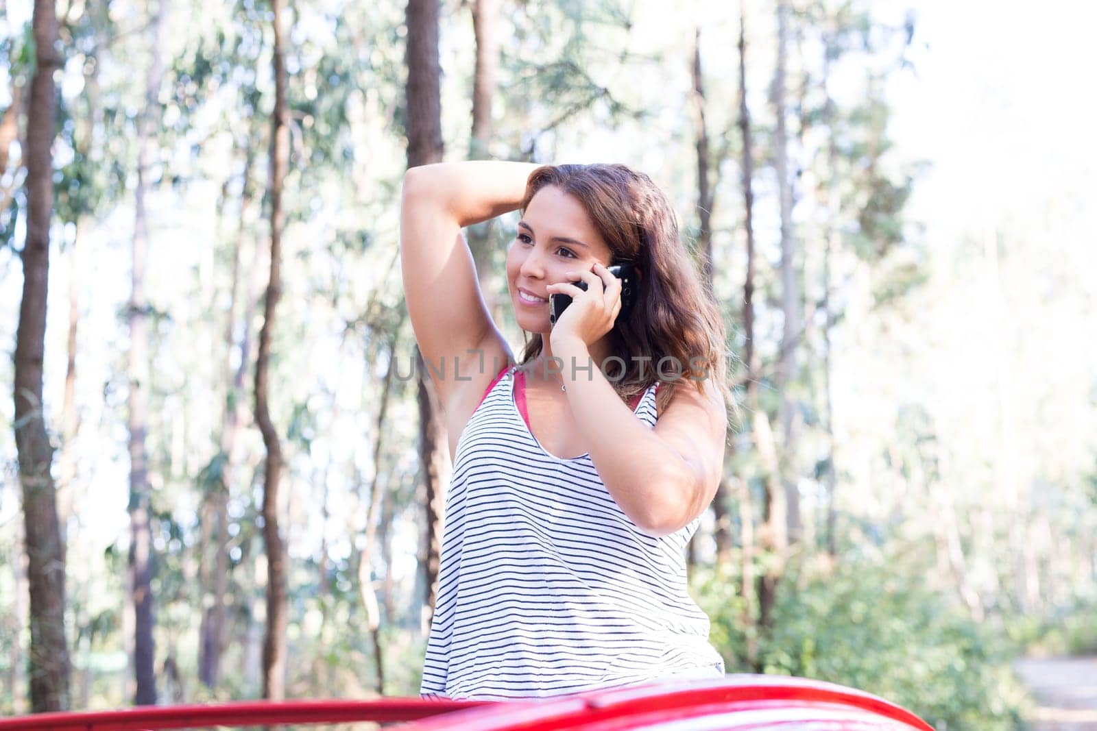 Young woman resting at car trip by the countryside