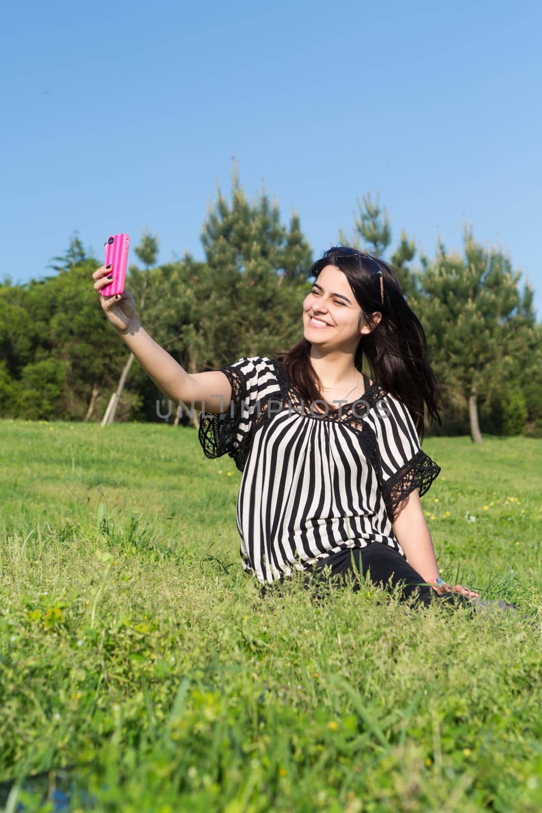 A beautiful young woman relaxing at the city park