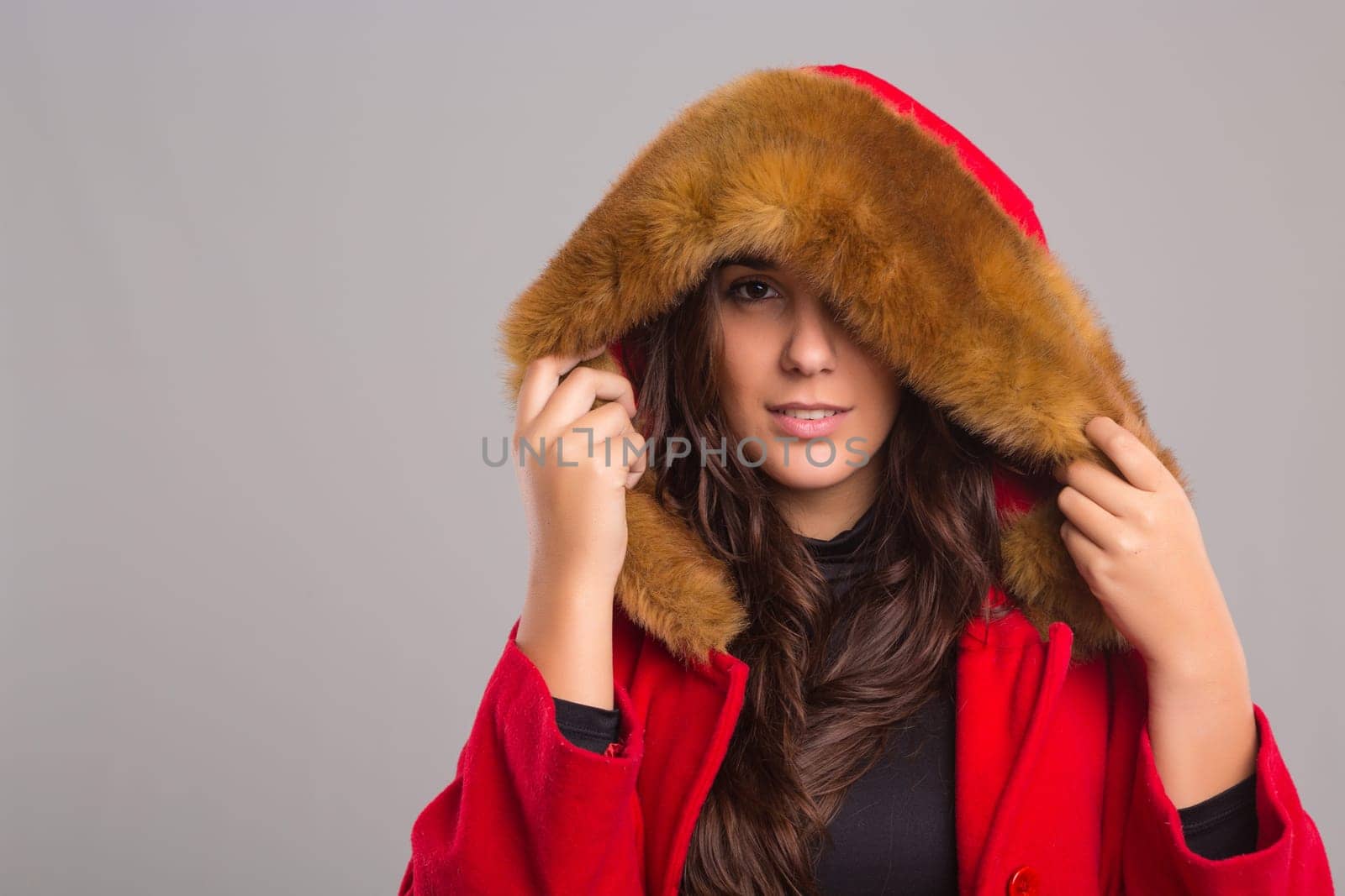A beautiful young woman dressed for winter