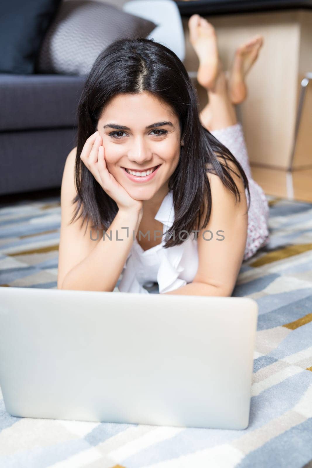 Beautiful woman relaxing with a computer