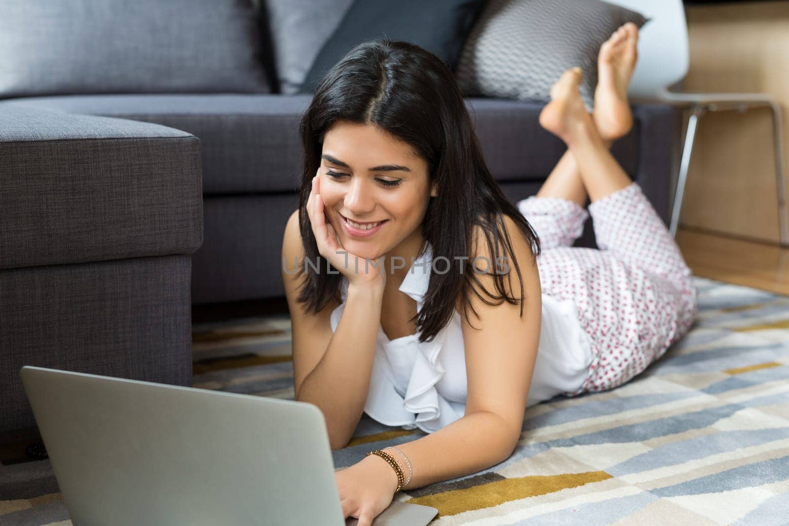 Beautiful woman relaxing with a computer