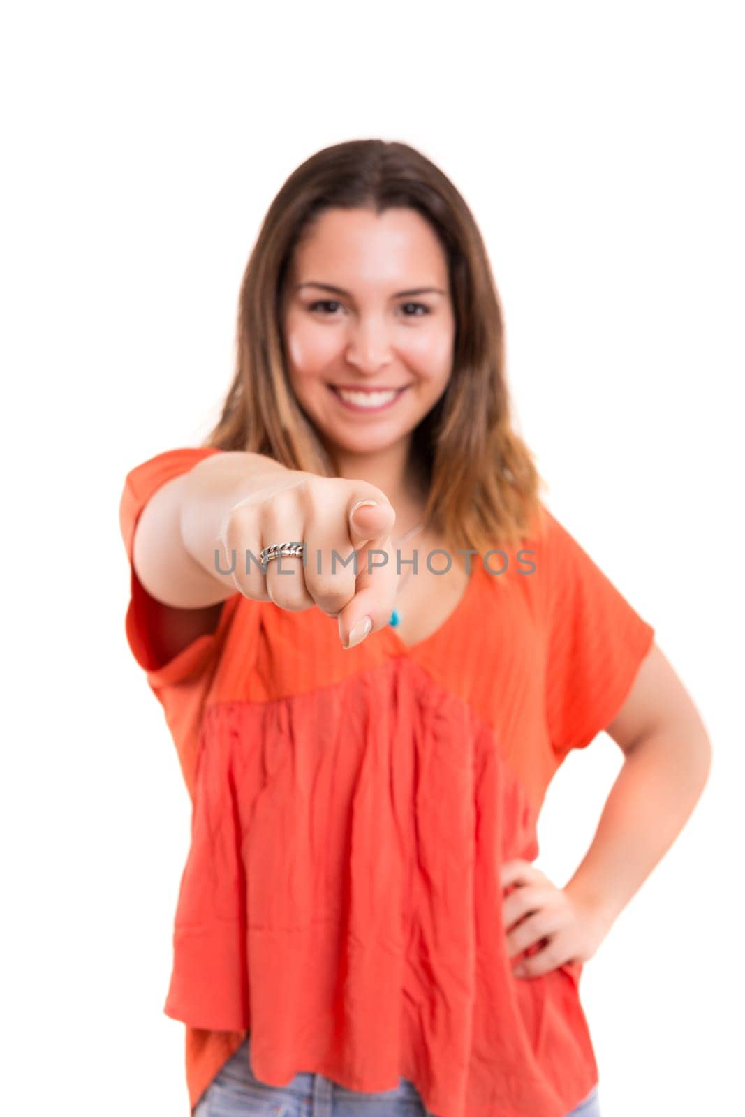 Young beautiful woman pointing at you, isolated over white