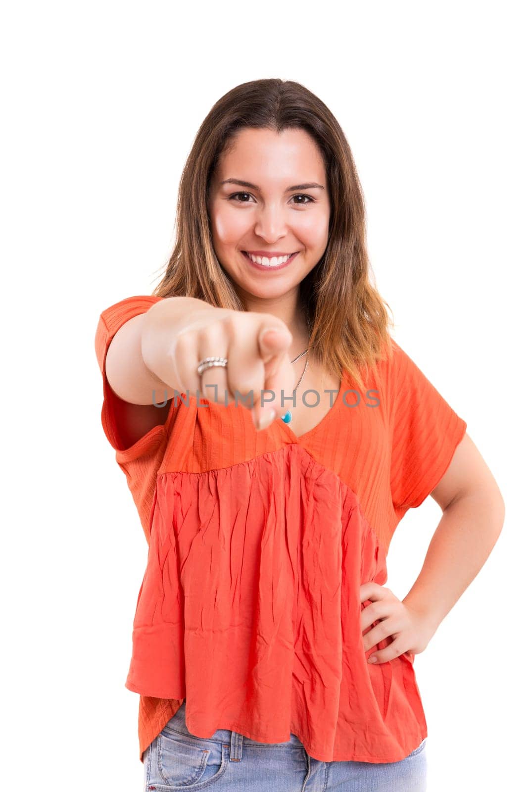 Young beautiful woman pointing at you, isolated over white
