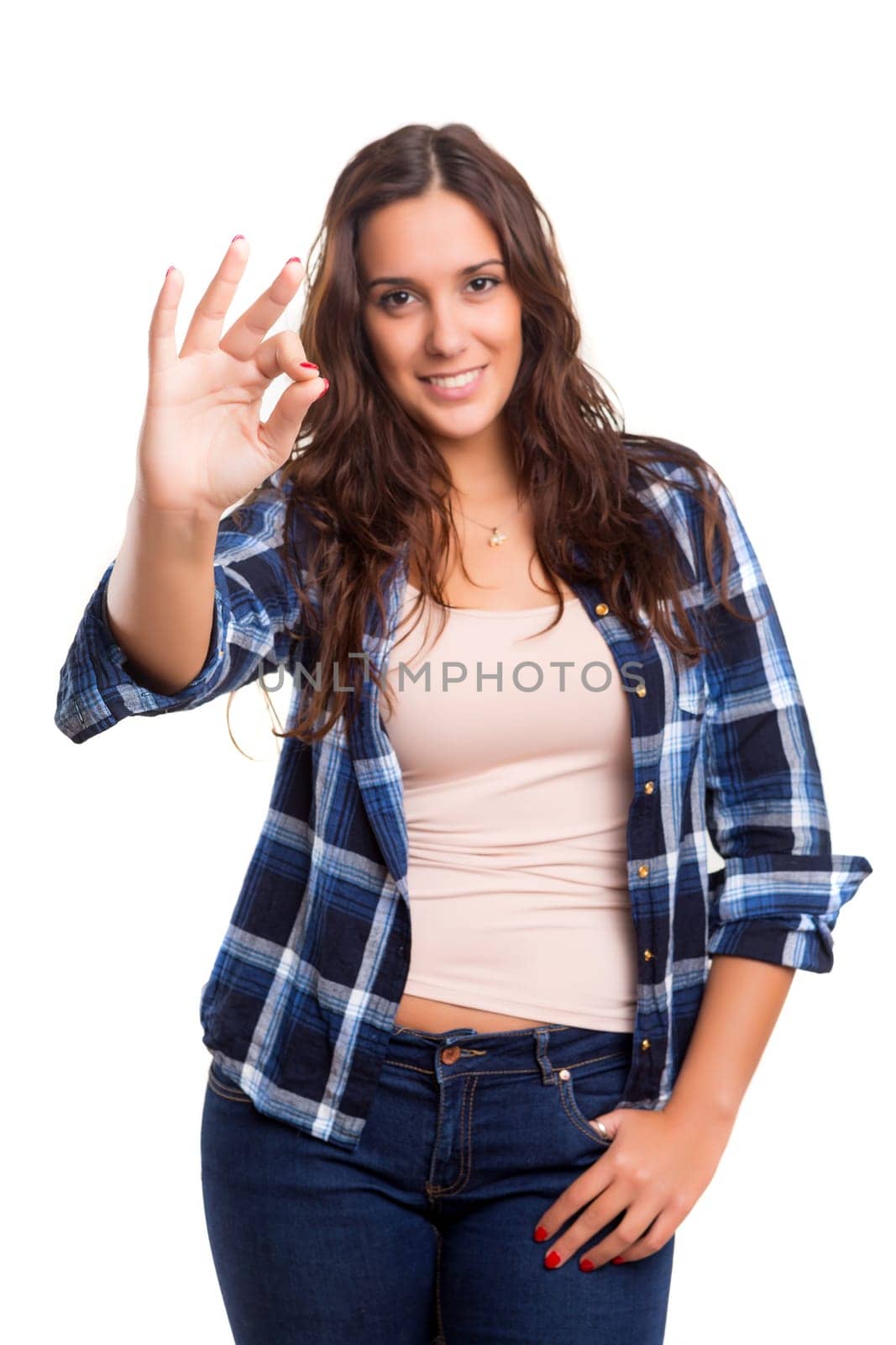 Beautiful young woman signaling ok, isolated over white