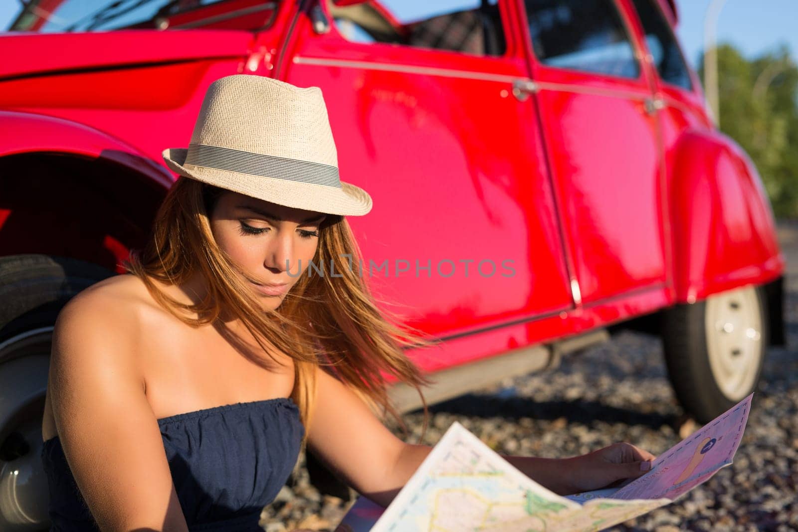 Woman going on a roadtrip in her convertible car