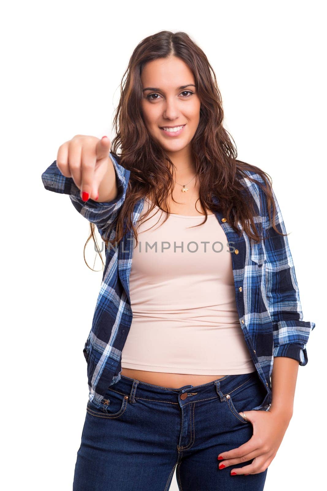 Young beautiful woman pointing at you, isolated over white