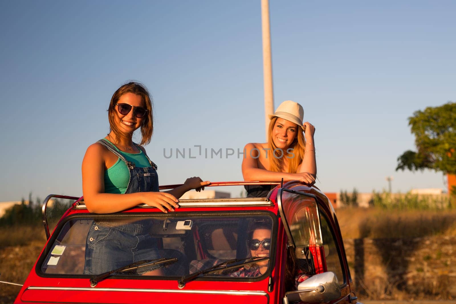 Group of friends on a roadtrip through countryside