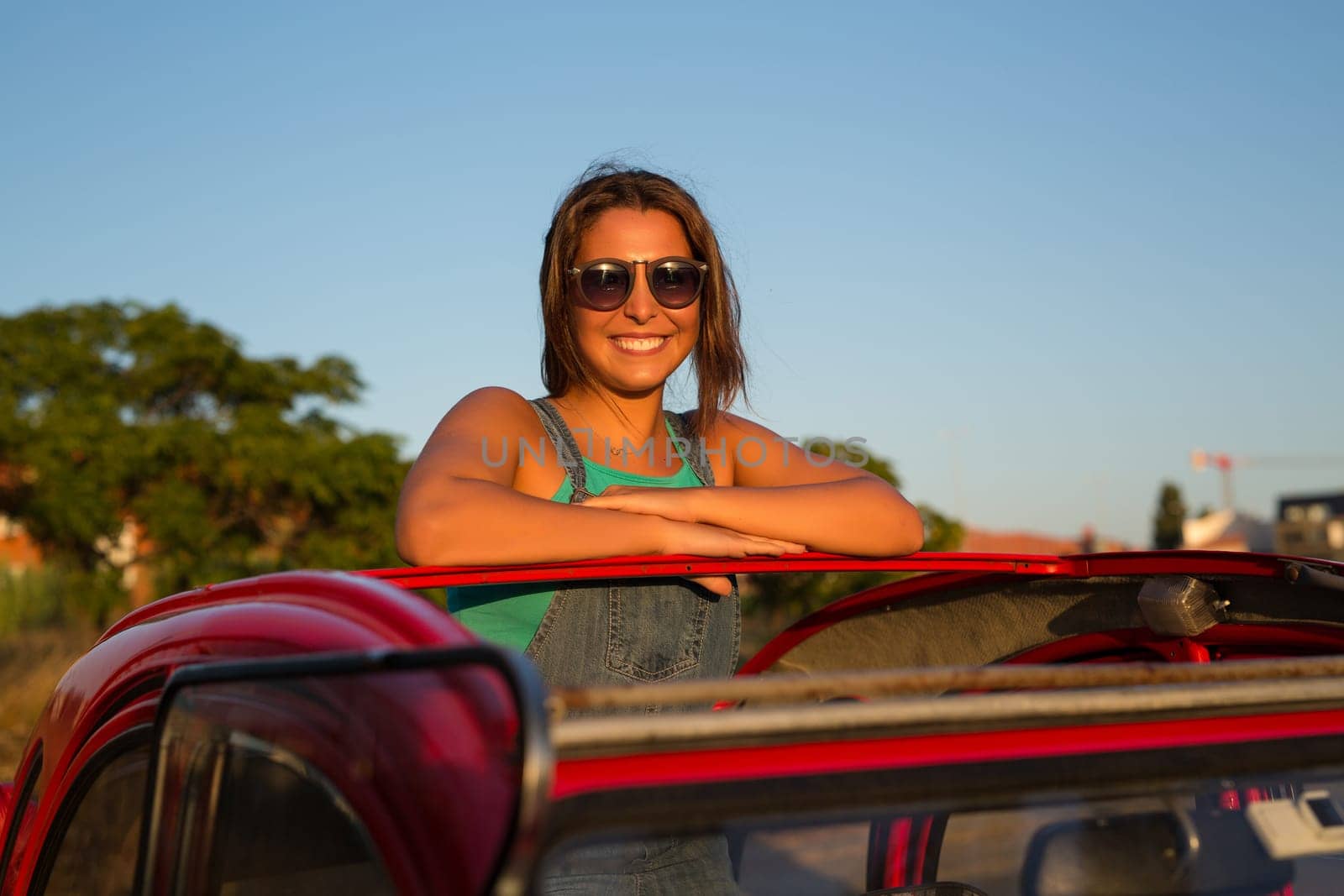 Woman going on a roadtrip in her convertible car