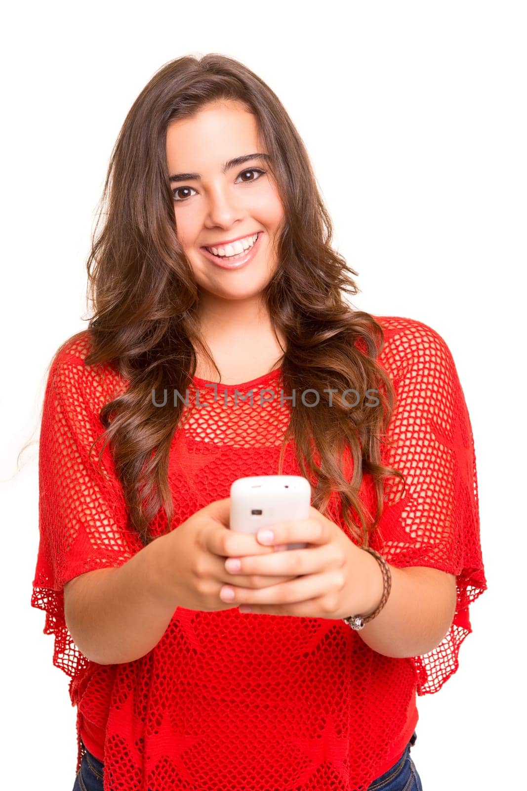 Teenager with cellphone, posing over a white background
