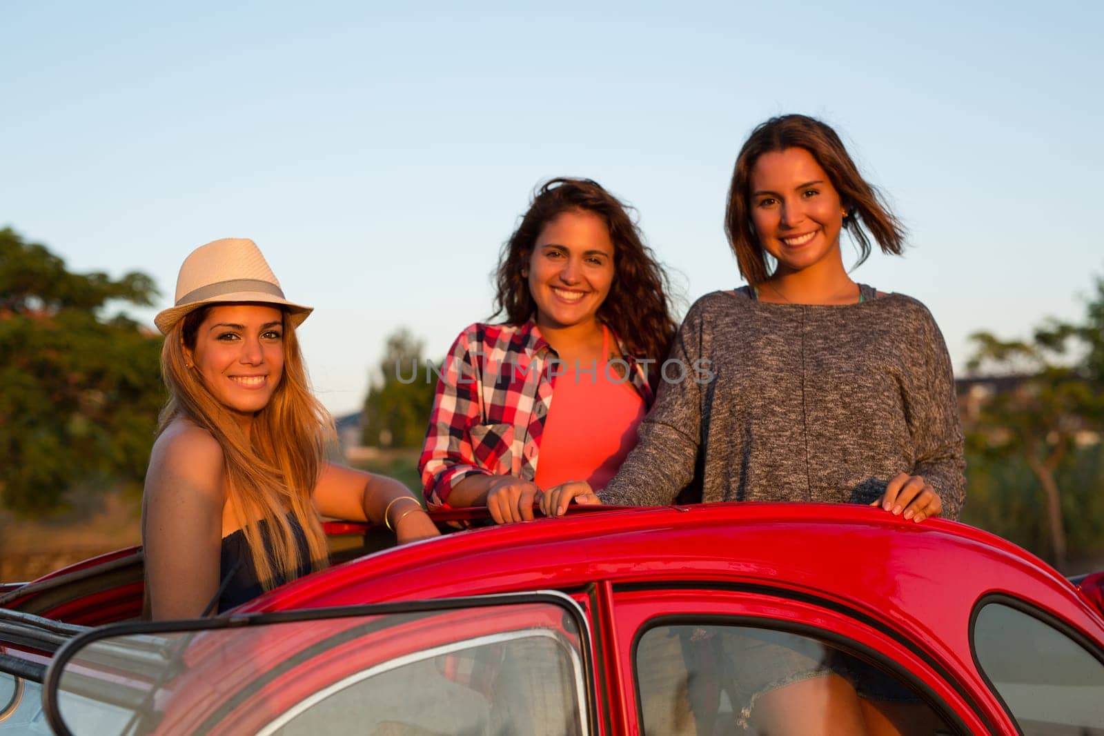 Group of friends on a roadtrip through countryside