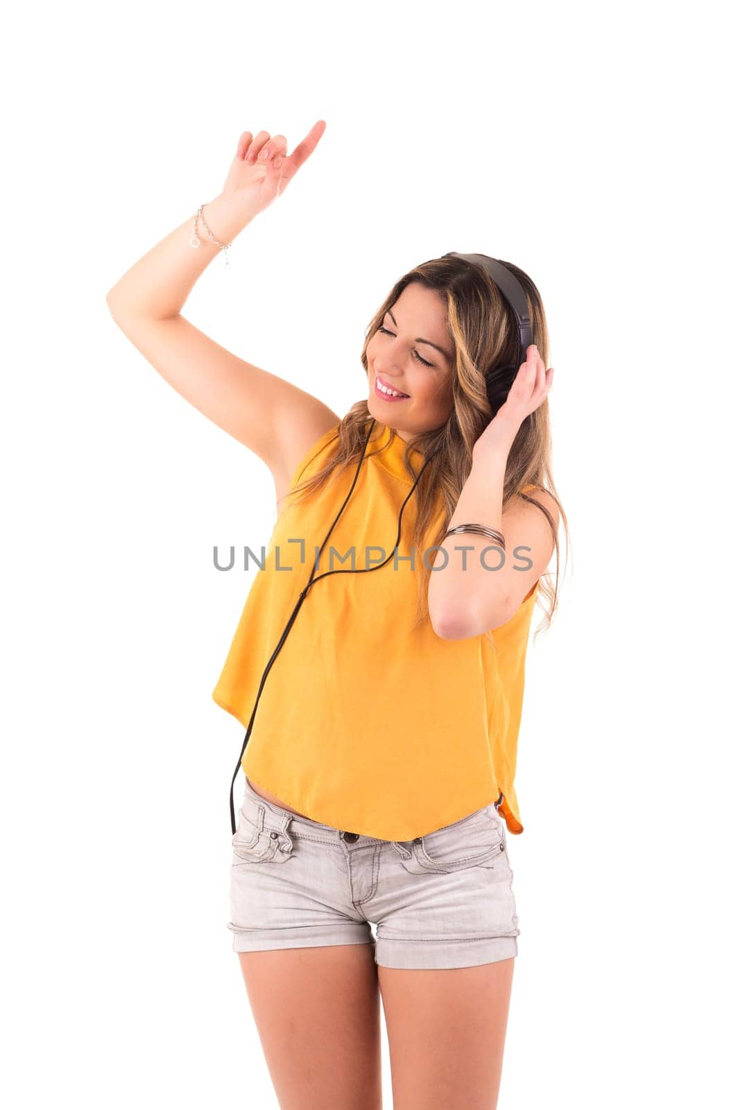 Happy young woman listening to music