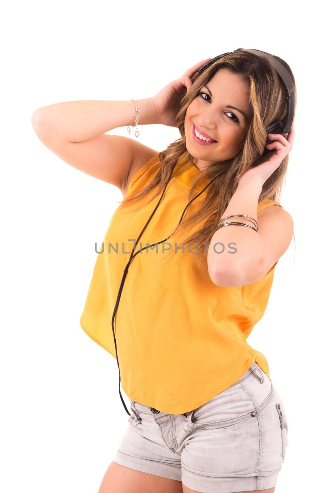Happy young woman listening to music