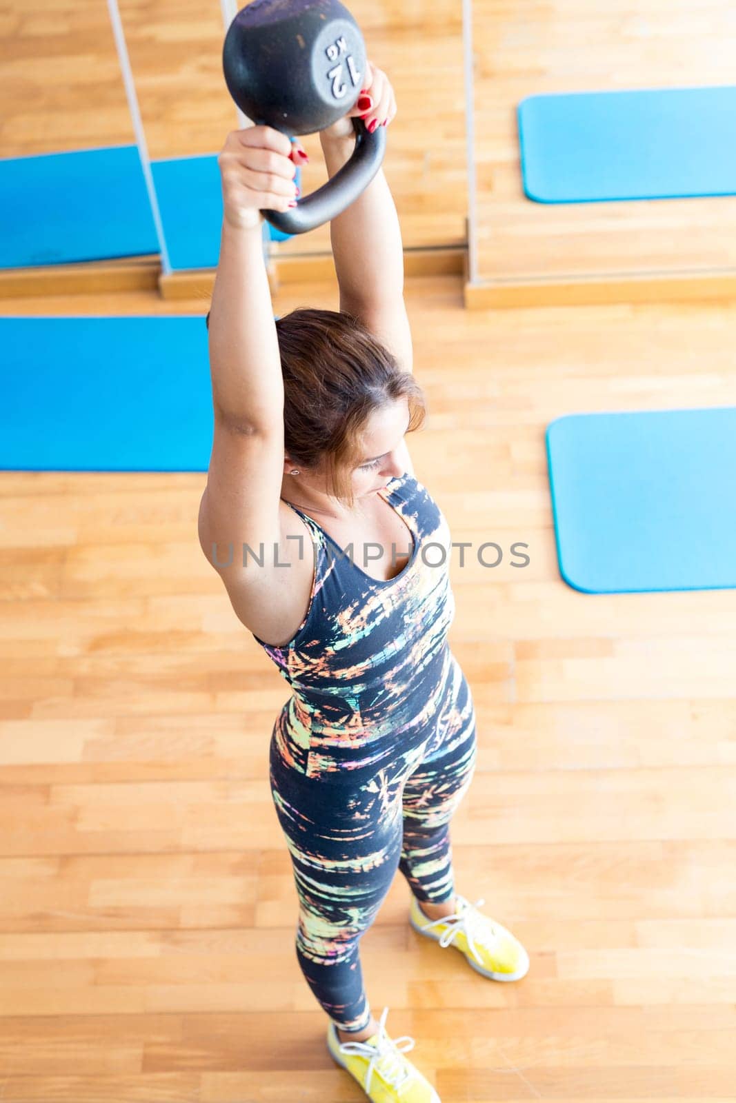 Young woman getting into shape with one more training session