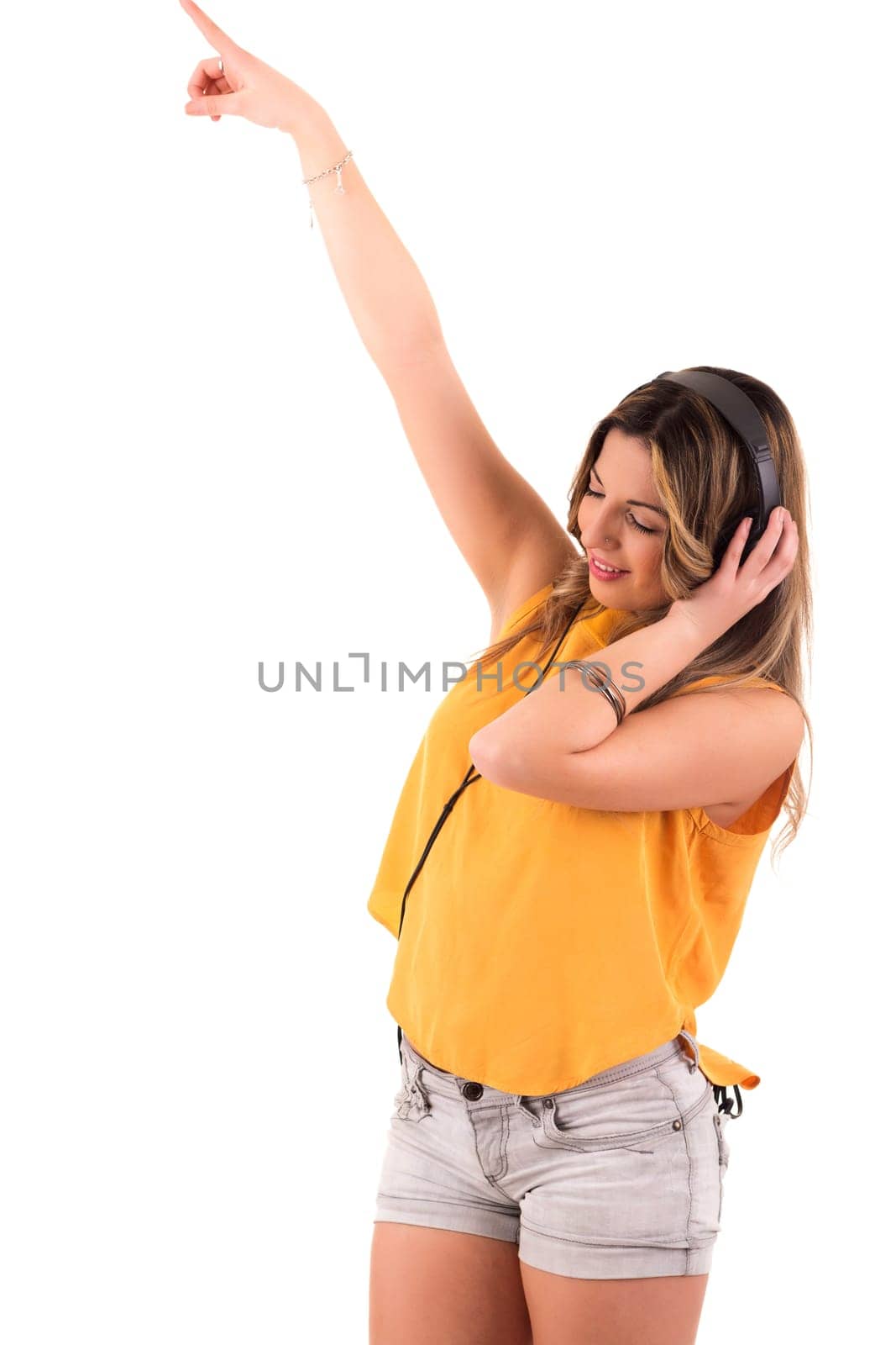 Happy young woman listening to music