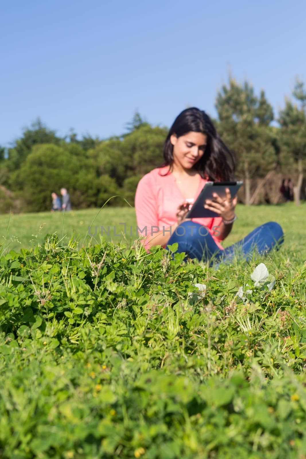 A beautiful young woman relaxing at the city park