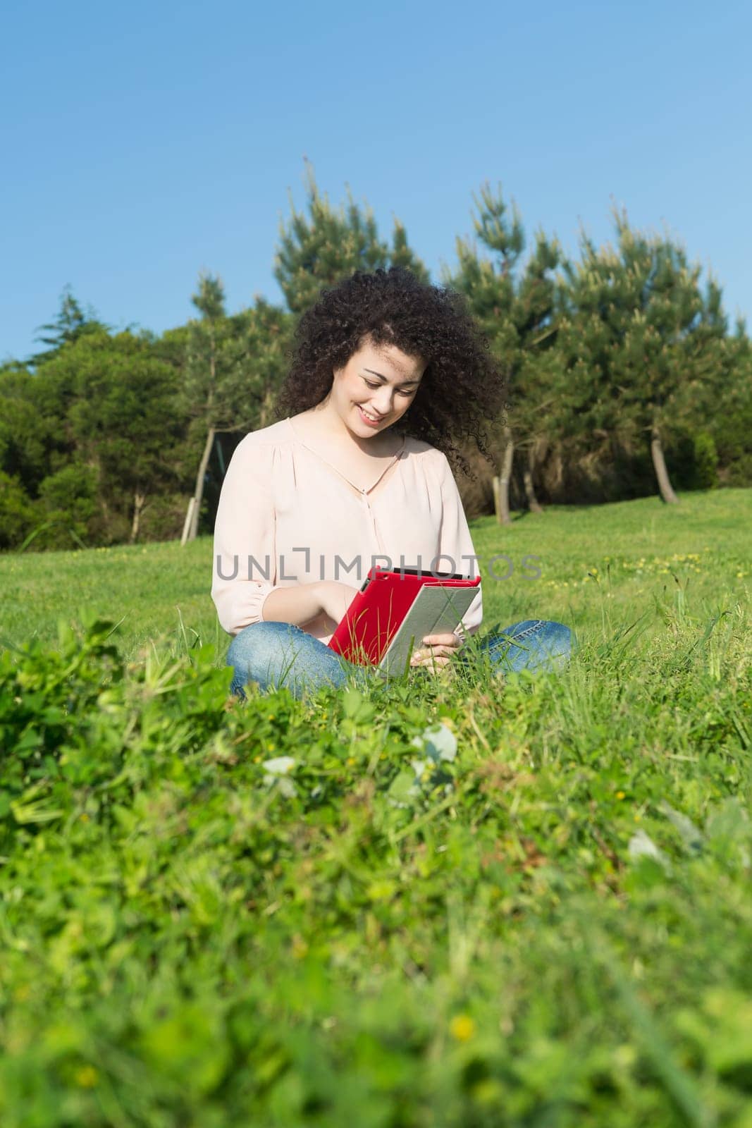 A beautiful young woman relaxing at the city park