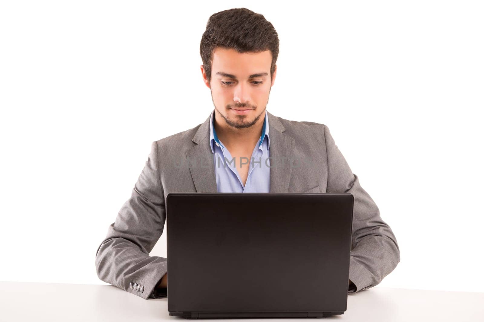 Young handsome man working with laptop computer