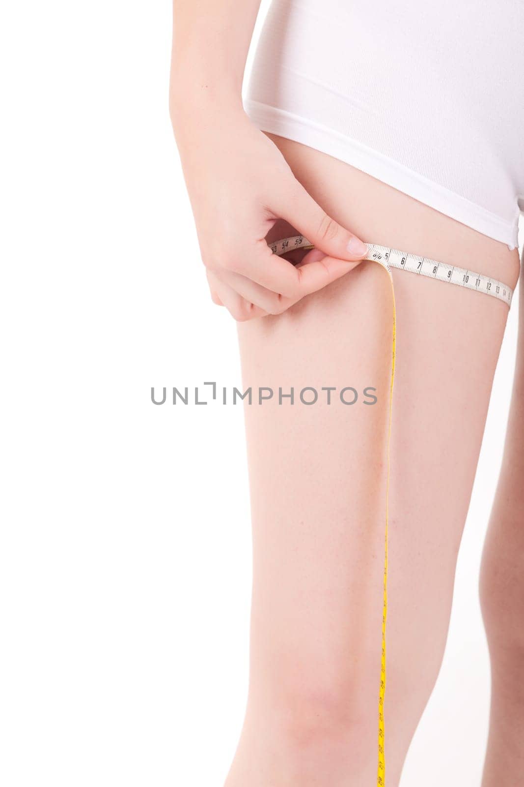 Young woman measuring her body - diet concept