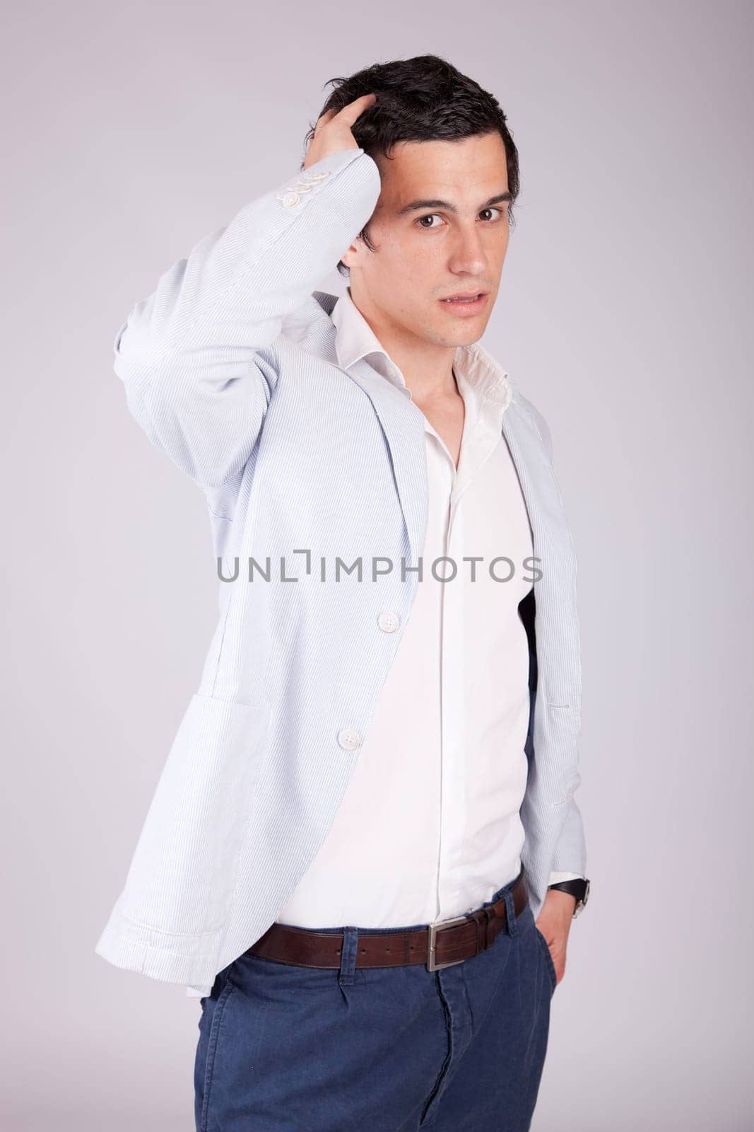 Young casual boy posing isolated