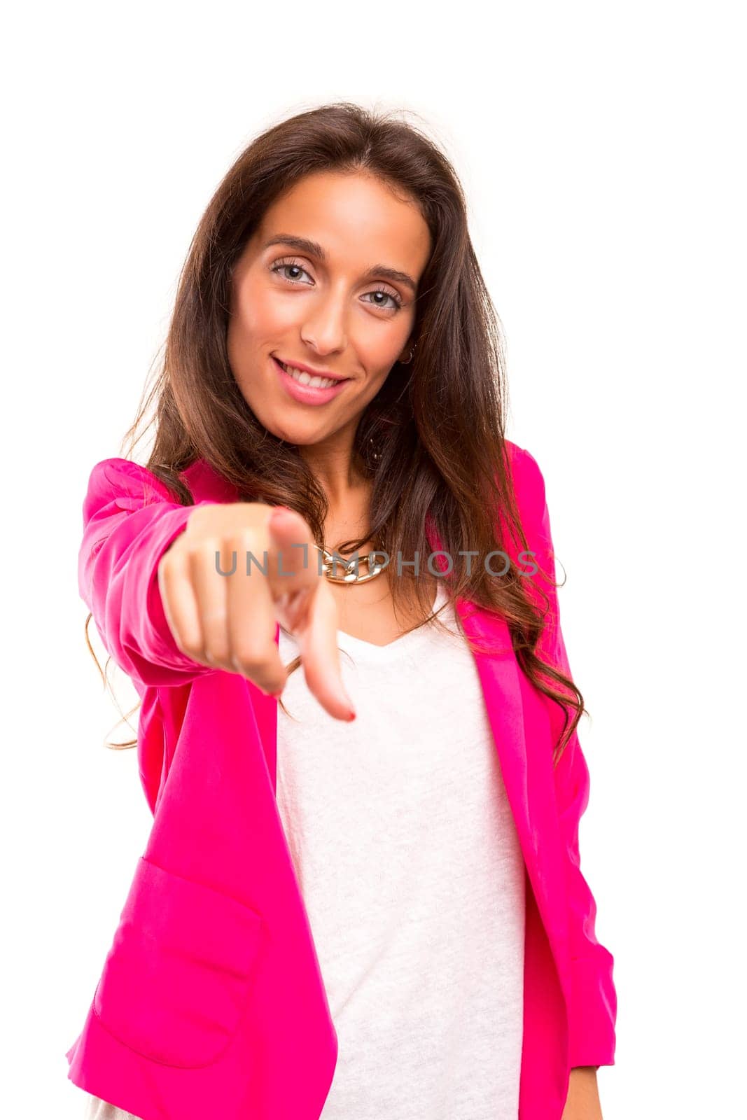 A beautiful business woman pointing at you, isolated over white