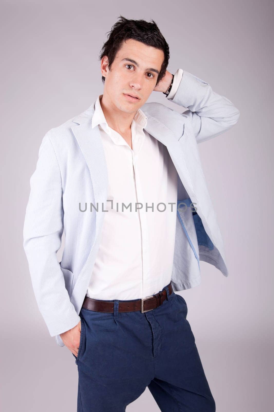 Young casual boy posing isolated