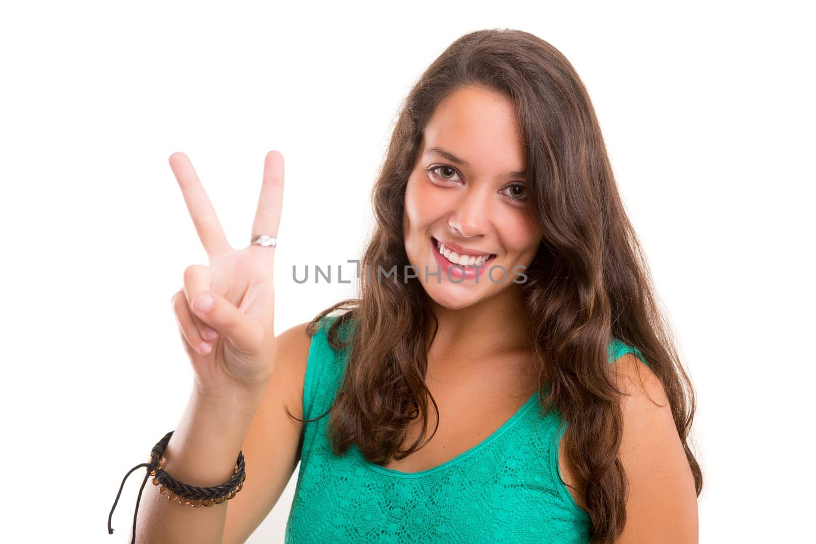 Beautiful young woman signaling ok, isolated over white