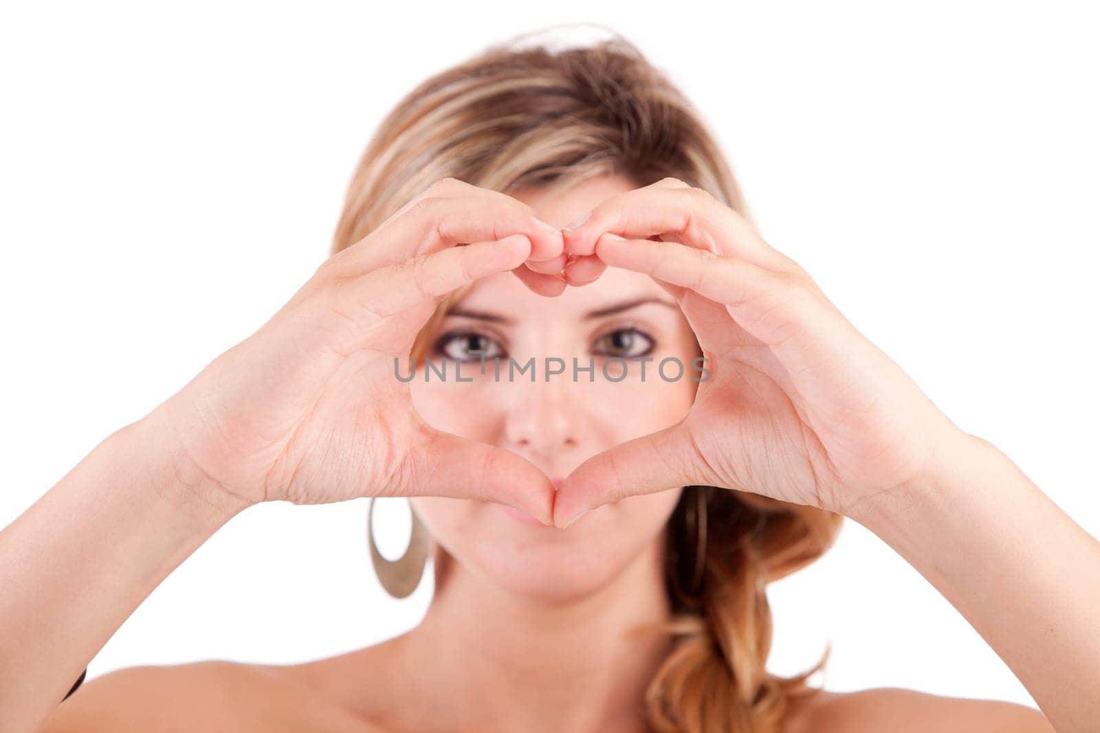 form of heart shaped by the hands of a young woman
