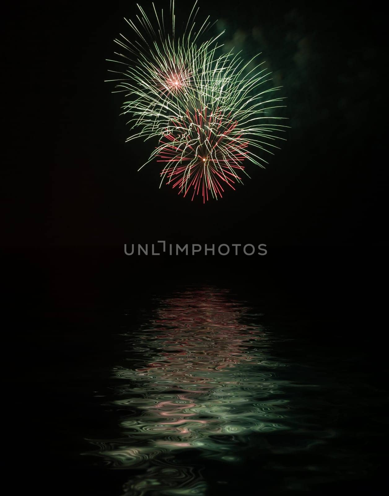 Fireworks with reflexes on water