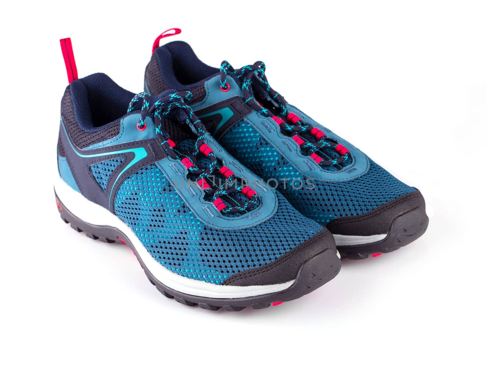 Pair of blue women's sneakers isolated on white bacxkground