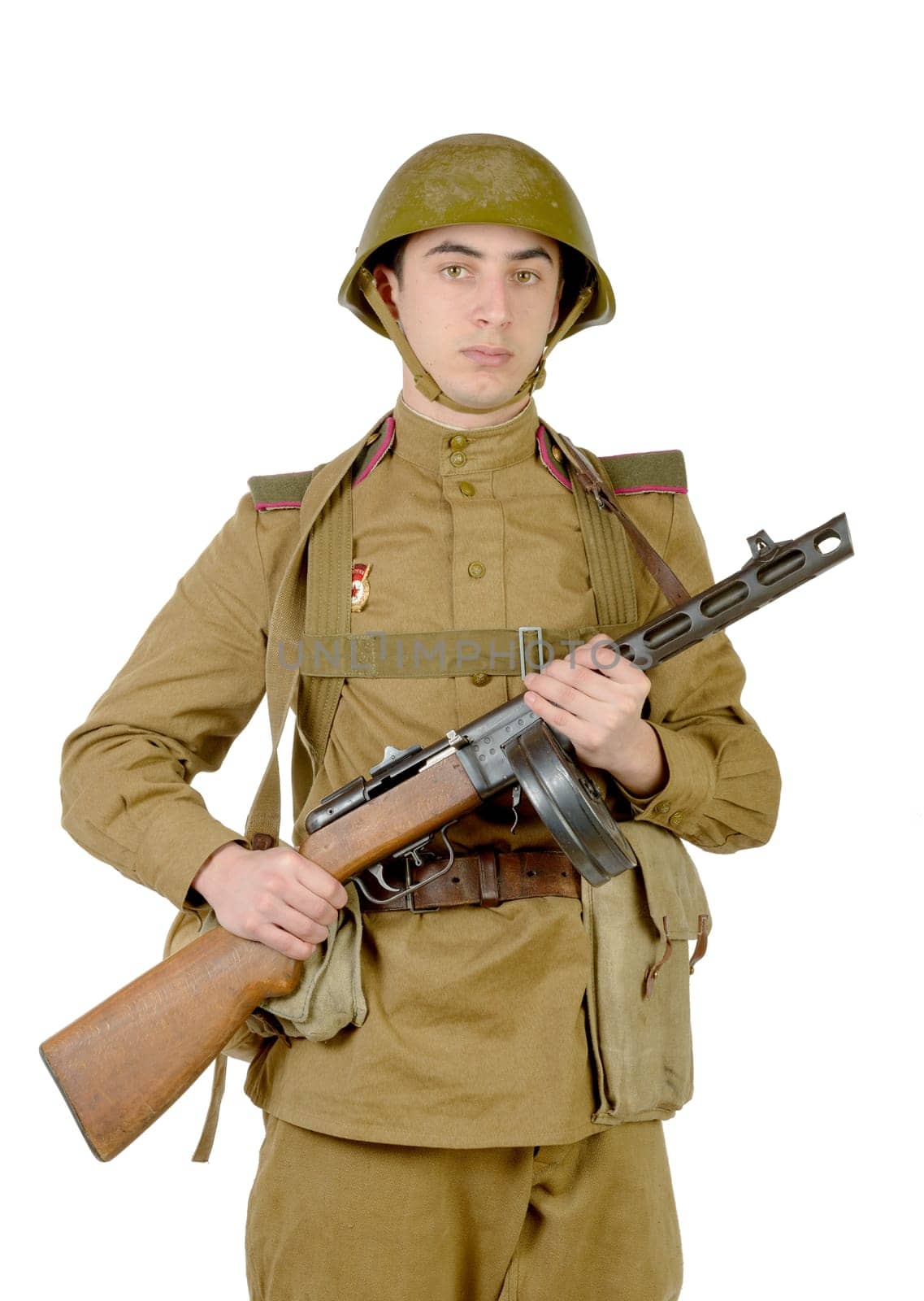 young Soviet soldier with machine gun on the white background