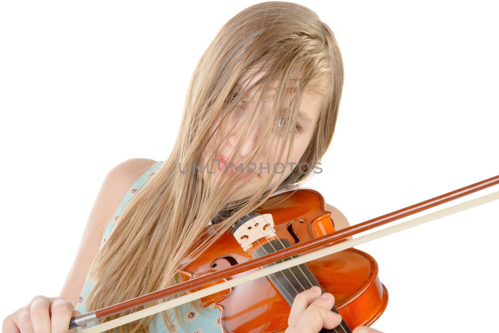 a teenage girl with long hair plays violin on the white background