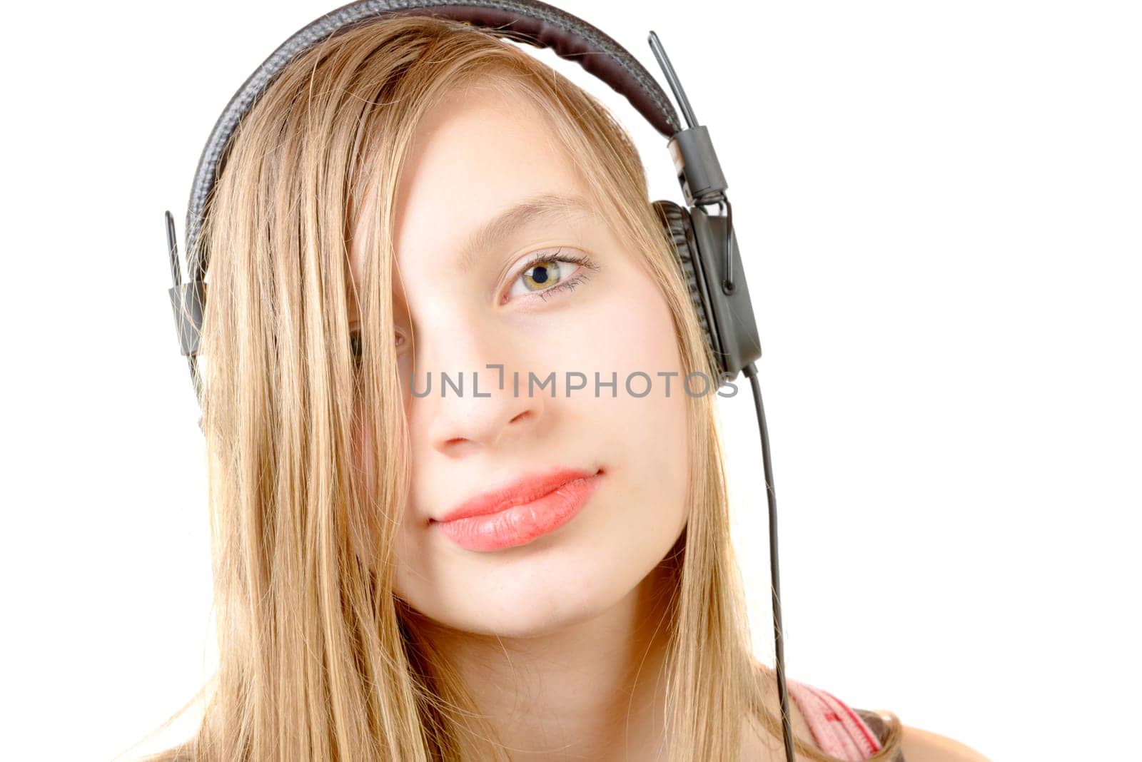 portrait of teenage girl with headphone on the white background