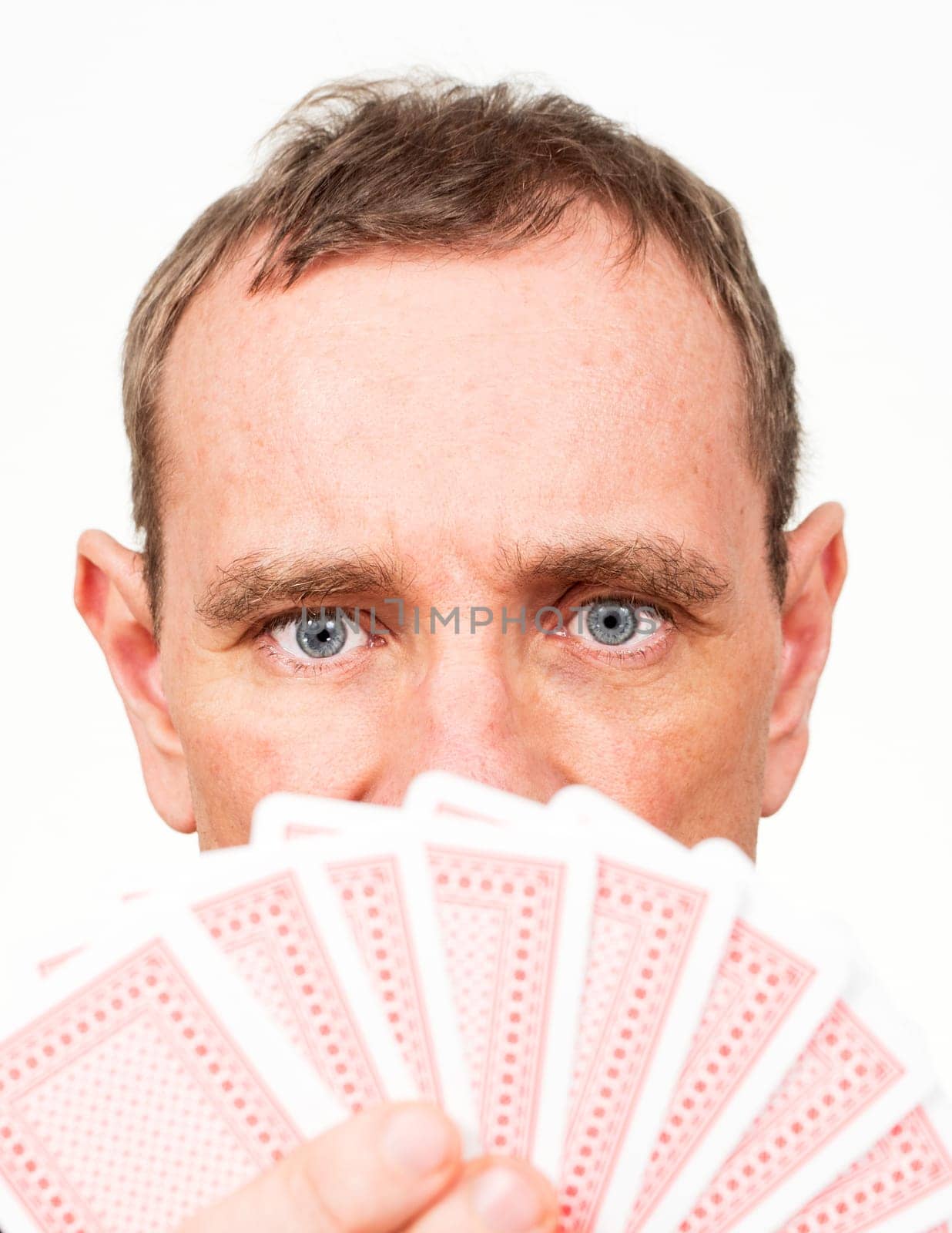 Man with fanned-out playing cards