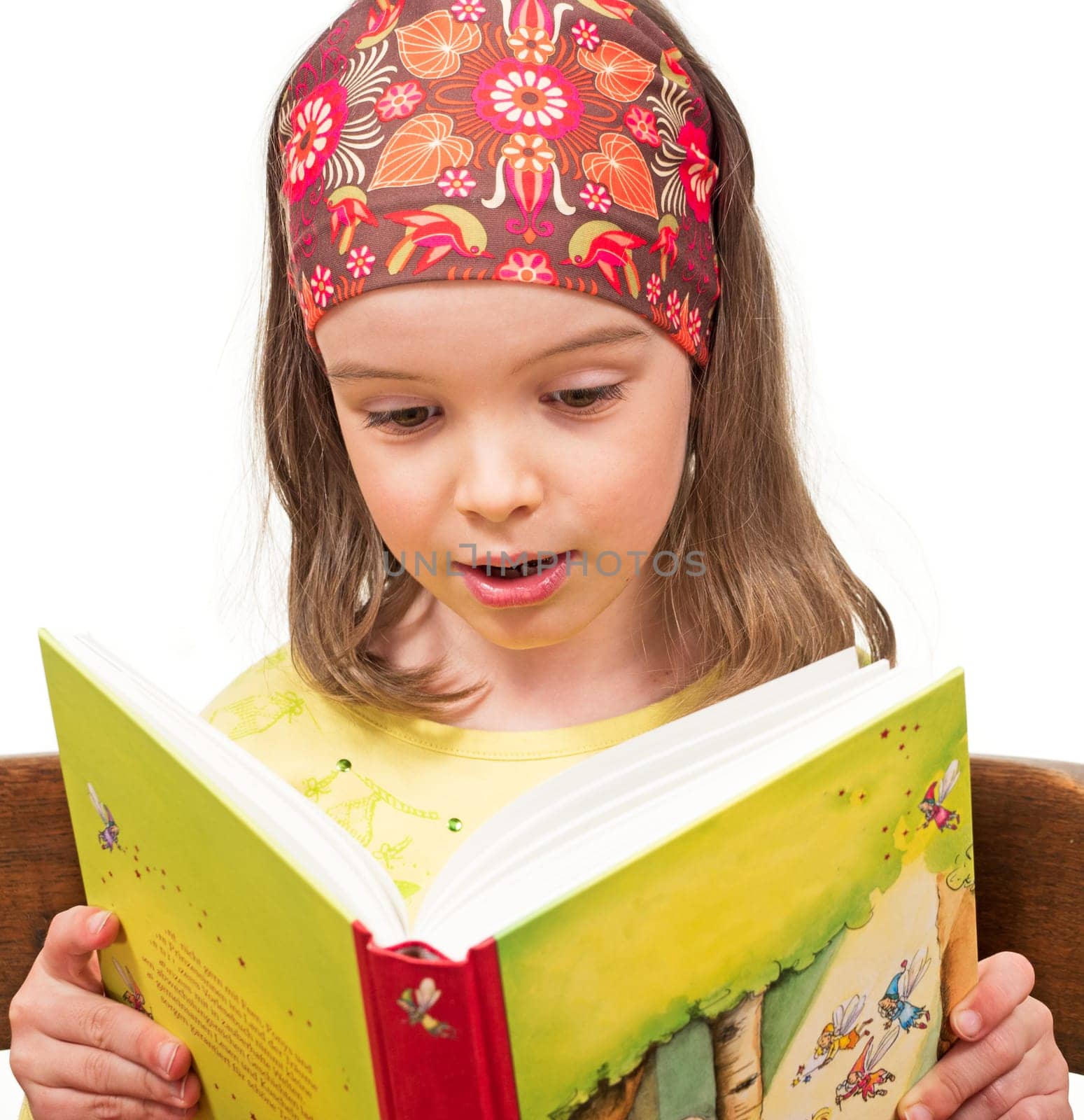 Child reads a book