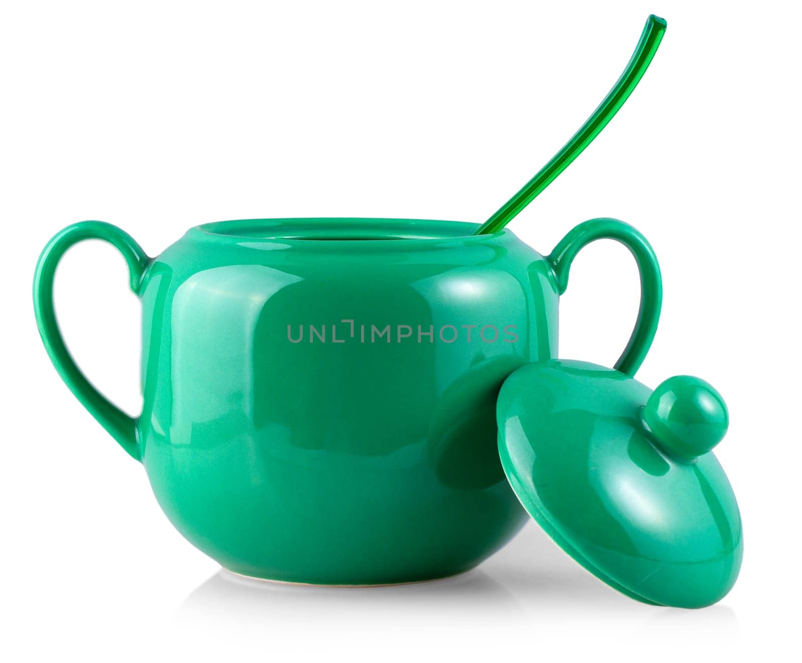 The sugar bowl and spoon on white background