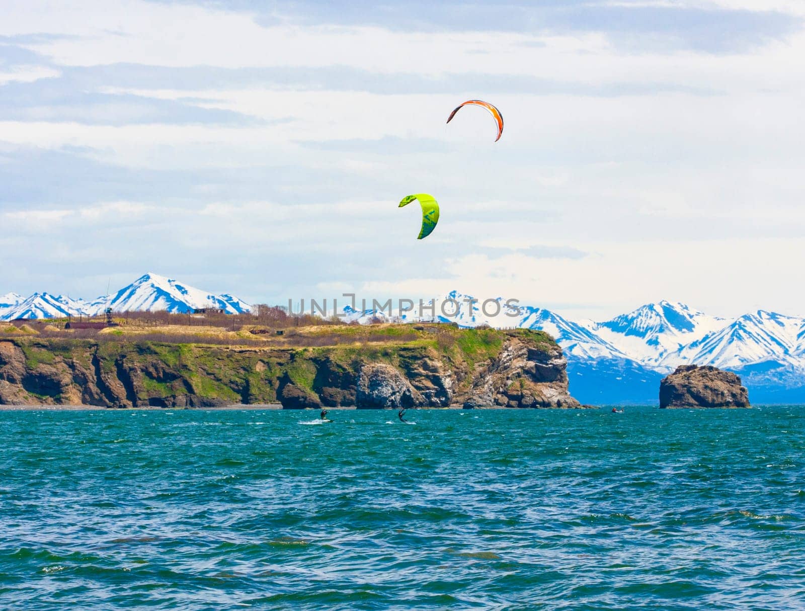 Kitesurfing, kiteboarding, kite surf. Extreme sport kitesurfing in Kamchatka Peninsula in the Pacific ocean