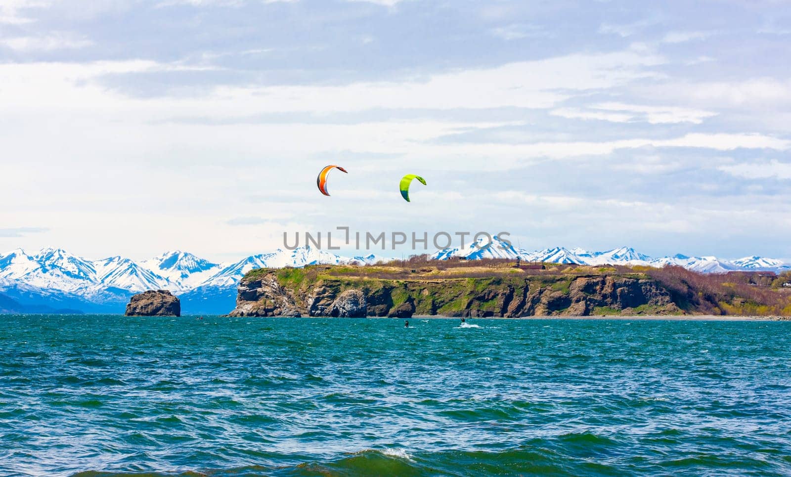 Kitesurfing, kiteboarding, kite surf. Extreme sport kitesurfing in Kamchatka Peninsula in the Pacific ocean