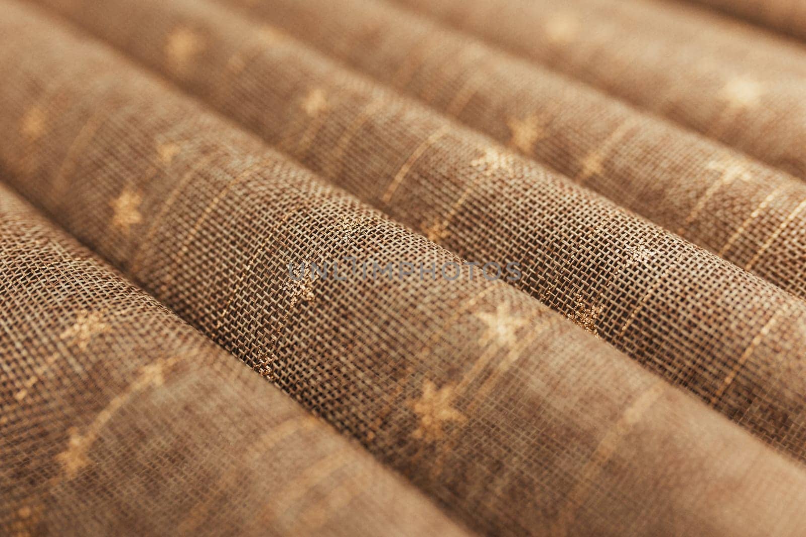 Folds of brown textile tablecloth. Blurred background. High quality photo